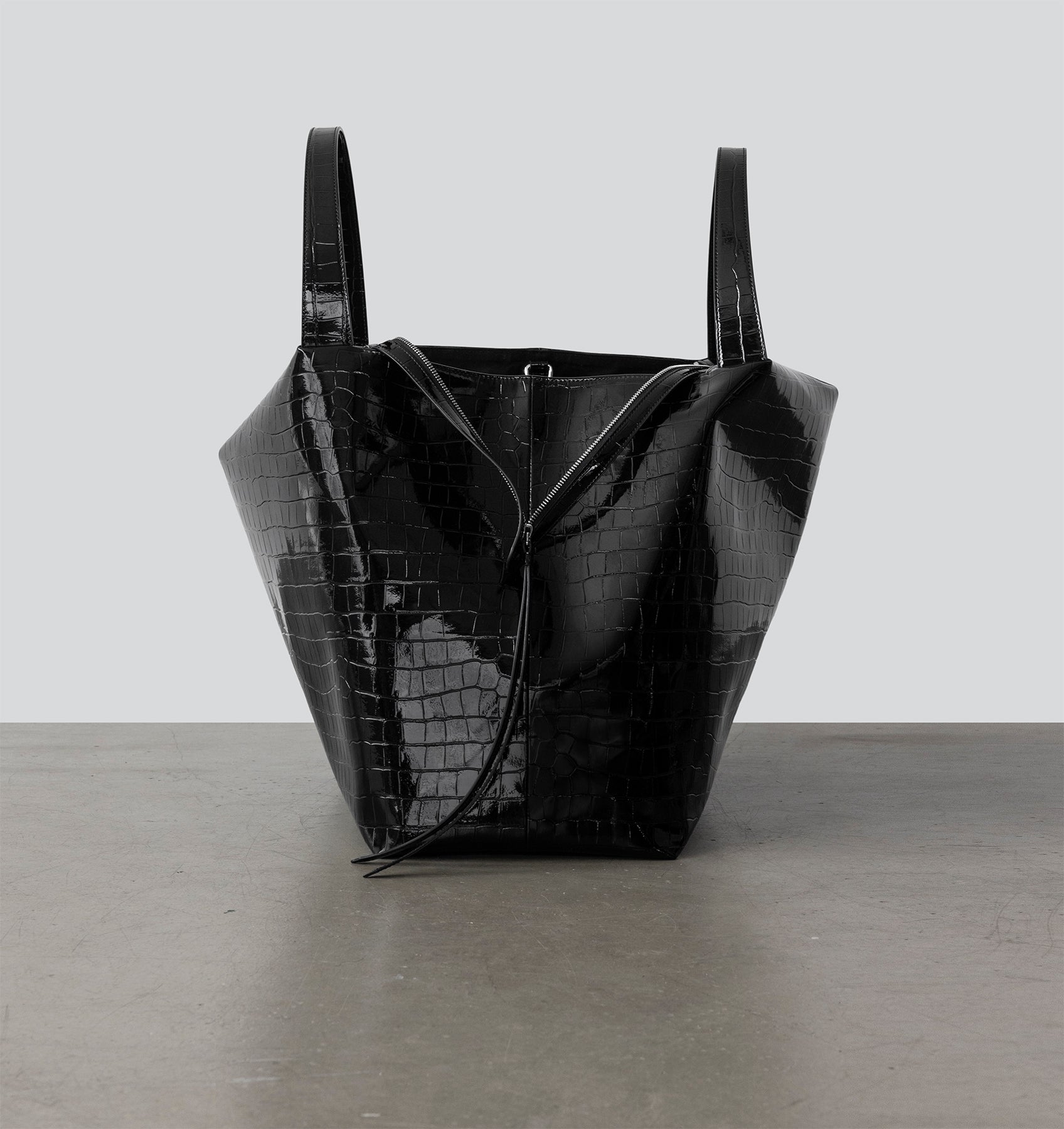 Front view of the LA MAMA LM1 luxury handbag in Black Lacquer Croco, crafted from croc-embossed vegan leather.