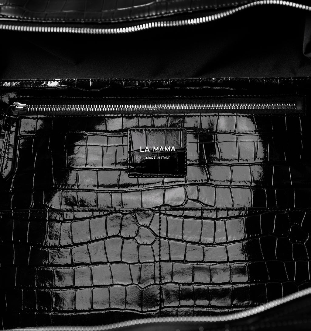 Close-up of the LA MAMA LM1 handbag in Black Lacquer Croco.