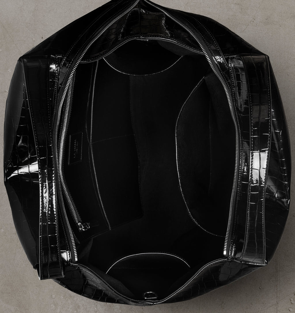 Interior view of the LA MAMA LM1 Black Lacquer Croco handbag with canvas lining.