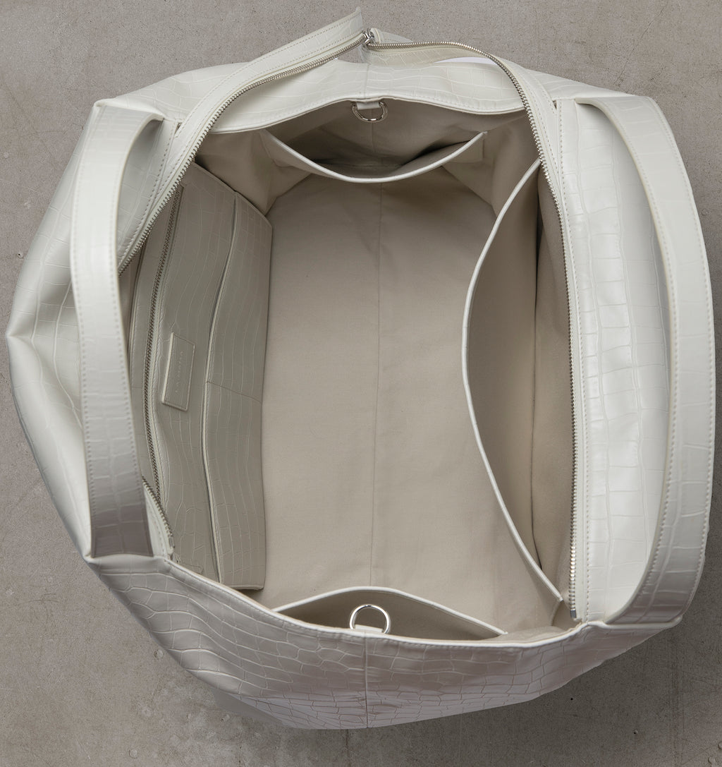 Interior view of the LA MAMA LM1 White Matte Croco handbag with canvas lining.