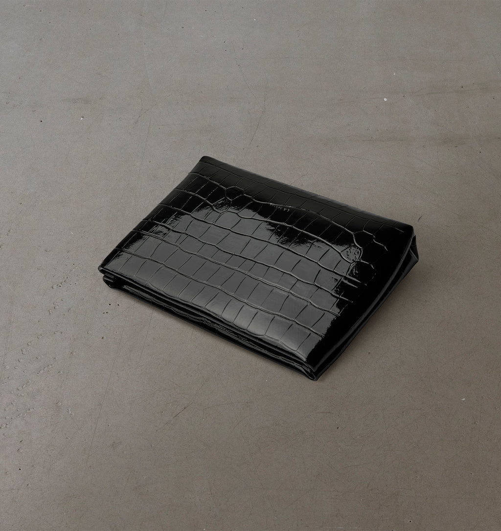 Top view of the LA MAMA Small Pouch in Black Lacquer Croco, crafted from croc-embossed vegan leather.